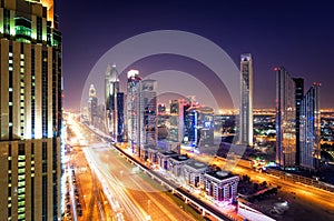 Amazing night dubai downtown skyline and traffic jam during rush hour. Sheikh Zayed road, Dubai, United Arab Emirates