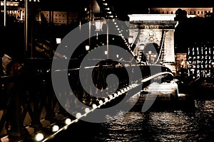 Amazing night view of the illuminated Chain Bridge close-up. Beautiful vintage lantern. Budapest