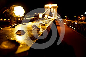 Amazing night view of the illuminated Chain Bridge close-up. Beautiful vintage lantern. Budapest