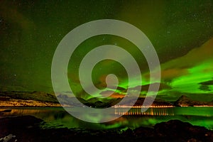 Amazing northern lights, Aurora borealis over the mountains in the North of Europe - Lofoten islands, Norway