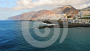 Amazing ocean landscape. Waves splashing break on the rocks. Canary Islands. Tenerife. Los Gigantes. Aerial drone view