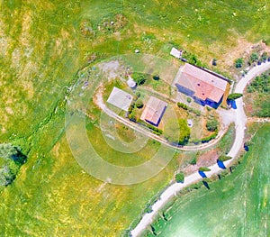 Amazing overhead aerial view of Agriturismo and surrounding hill photo