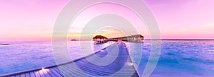 Amazing panorama beach landscape. Maldives sunset seascape view. Horizon with sea and sky. Tranquil scenery, tourism and travel