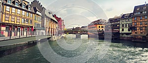 Amazing panorama of colorful romantic city Strasbourg, France, Alsace. Traditional houses on the both sides of the river and an