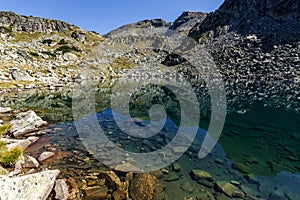 Amazing Panorama of Lake and reflection of Preokorets Popova Kapa peak, Rila Mountain photo