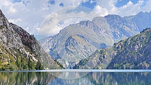 Amazing panorama of the summer seascape. View of the beautiful lake of Sary Chelek. The State Biosphere Reserve