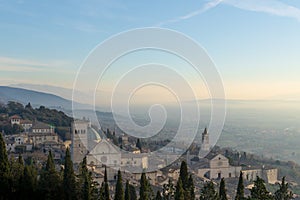 Amazing panorama view of Assisi, province of Umbria city skyline and skyscraper at sunset.