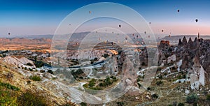 Amazing panoramic aerial view of hot air balloons at sunrise in Goreme National Park.Uchisar Castle. Cappadocia.Turkey.