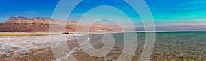 Amazing panoramic Dead Sea with blue and teal colors in the middle of the day