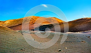 Amazing panoramic landscape of volcano craters in Timanfaya national park. Popular touristic attraction in Lanzarote island,