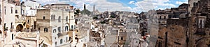 Amazing panoramic view from a balcony of typical stones Sassi di Matera and church of Matera UNESCO European Capital of Culture