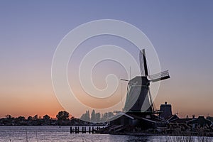 Amazing Picturesque View of traditional Dutch Windmills At Sunset