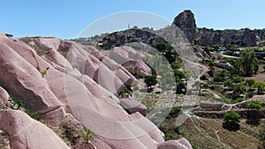 Amazing pink rocks and Uchisar castle in the background at Cappadocia, Turkey