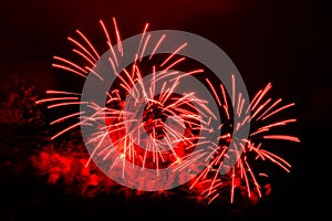 Amazing red fireworks on dark background