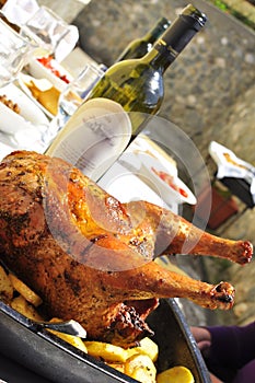 Amazing roasted chicken with wine bottle