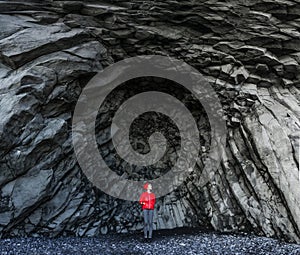 Amazing rocks in iceland and woman torist inside