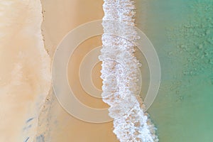 Amazing seascape Aerial view sandy beach and clear turquoise water sea waves crashing on beach Beautiful tropical sea in the