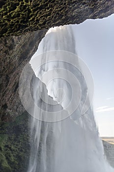 Amazing Seljalandfoss waterfall in sunny autumn day, Iceland. Famous tourist attraction