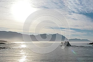 Amazing shot of a little luxury cruise ship anchored next to an exotic tropical island