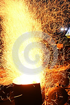 Amazing Sparks in the Dark. Beautiful abstract background on the theme of fire, light and life. Sparks fly in the sky