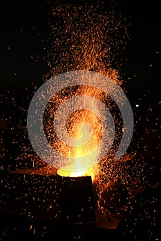 Amazing Sparks in the Dark. Beautiful abstract background on the theme of fire, light and life. Sparks fly in the sky