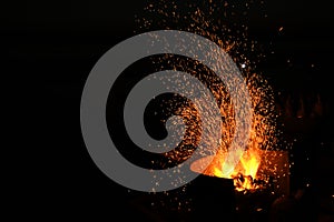 Amazing Sparks in the Dark. Beautiful abstract background on the theme of fire, light and life. Sparks fly in the sky