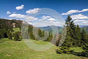 Amazing spring mountain landscape with blue sky and clouds