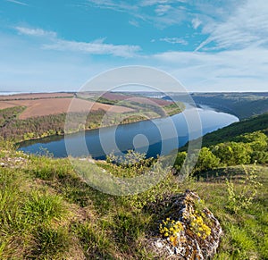 Amazing spring view on the Dnister River Canyon with picturesque rocks, fields, flowers. This place named Shyshkovi Gorby,