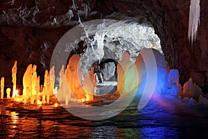 Amazing stalagmite illuminations in cave photo