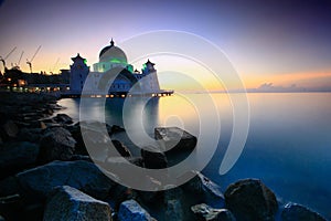 Amazing Straits Mosque of Malacca during sunrise with reflection