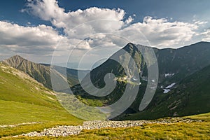 Amazing summer mountains under blue sky with clouds