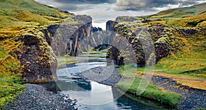 Amazing summer view of Fjadrargljufur canyon and river. Marvelous midnight sun scene of South east Iceland, Europe. Beauty of natu