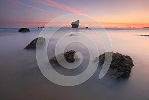 Amazing sunrise over Aguilar beach Asturias