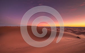 Amazing sunrise over the dunes Erg Chebbi in the Sahara desert near Merzouga, Morocco , Africa. Beautiful sand landscape with stun