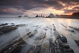 Amazing sunrise over Gueirua beach Asturias