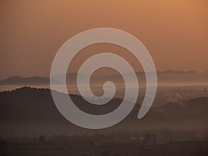 Amazing Sunrise Over Misty Landscape. Scenic View Of Foggy Morning Sky With Rising Sun Above Misty