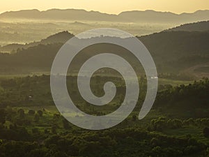 Amazing Sunrise Over Misty Landscape. Scenic View Of Foggy Morning Sky With Rising Sun Above Misty