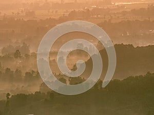 Amazing Sunrise Over Misty Landscape. Scenic View Of Foggy Morning Sky With Rising Sun Above Misty