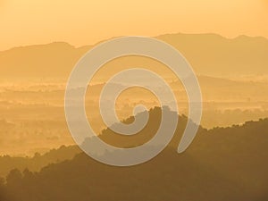 Amazing Sunrise Over Misty Landscape. Scenic View Of Foggy Morning Sky With Rising Sun Above Misty