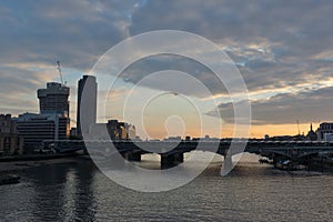 Amazing sunset Cityscape from Millennium Bridge and Thames River, London, Great Britain