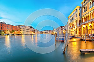 Amazing sunset and evening cityscape of Venice with famous Canal Grande and Rialto Bridge