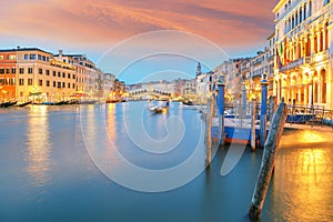 Amazing sunset and evening cityscape of Venice with famous Canal Grande and Rialto Bridge