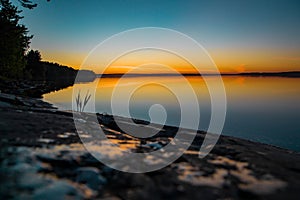 Amazing sunset on the lake,  water reflection