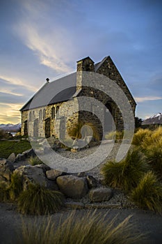 Amazing sunset at the most beautiful Church Of The Good Shepherd by Lake Tekapo, South Island, New Zealand. Dramatic sky, evening