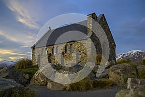 Amazing sunset at the most beautiful Church Of The Good Shepherd by Lake Tekapo, South Island, New Zealand. Dramatic sky, evening