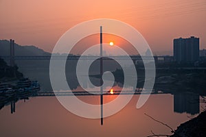 Amazing sunset over a bridge and river