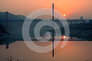 Amazing sunset over a bridge and river