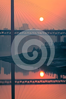 Amazing sunset over a bridge and river