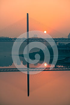 Amazing sunset over a bridge and river