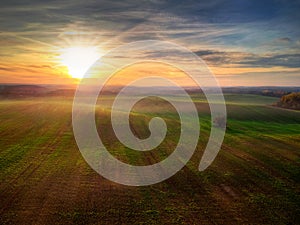 Amazing sunset over the green field, Poland